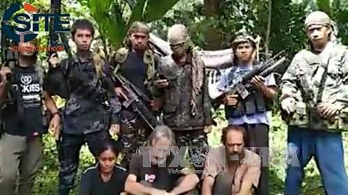 ក្រុមភេរវកម្ម Abu Sayyaf នៅហ្វីលីពីនគំរាមកំហែងកាត់ក្បាលចំណាប់ខ្មាំងមួយនាក់ ទៀត - ảnh 1